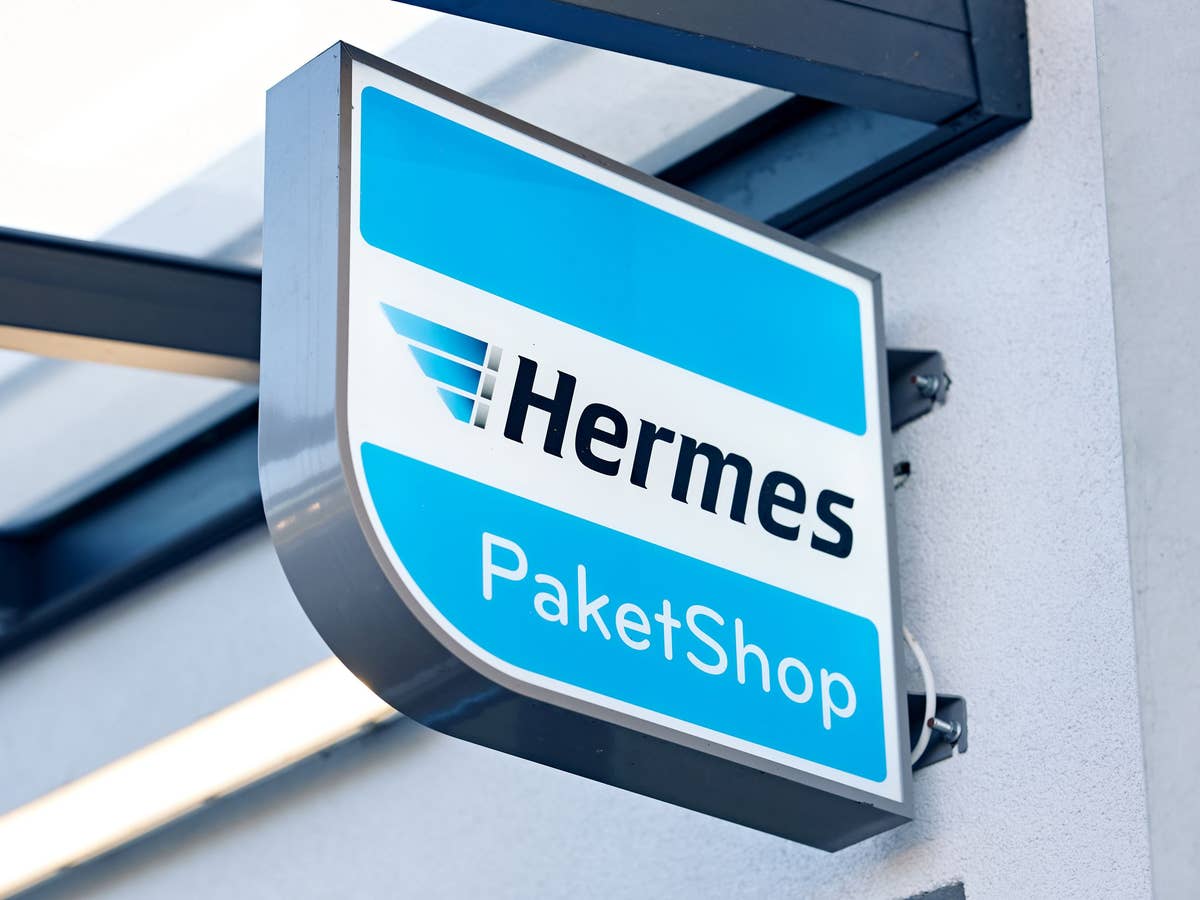 Hermes Paketshop-Logo an einer Hauswand