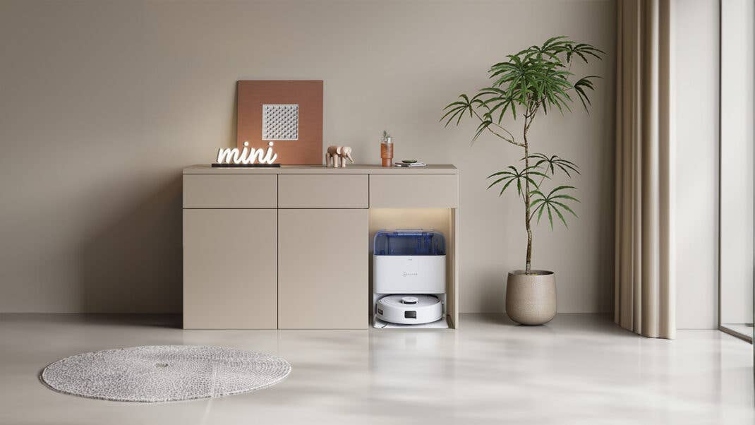 ECOVACS DEBOT MINI in Blau Steht in Einem Sideboard.