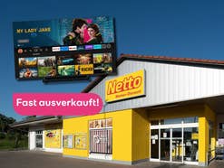 Netto-Filiale im Hintergrund, davor ein 4K-Fernseher, welcher fast ausverkauft ist.