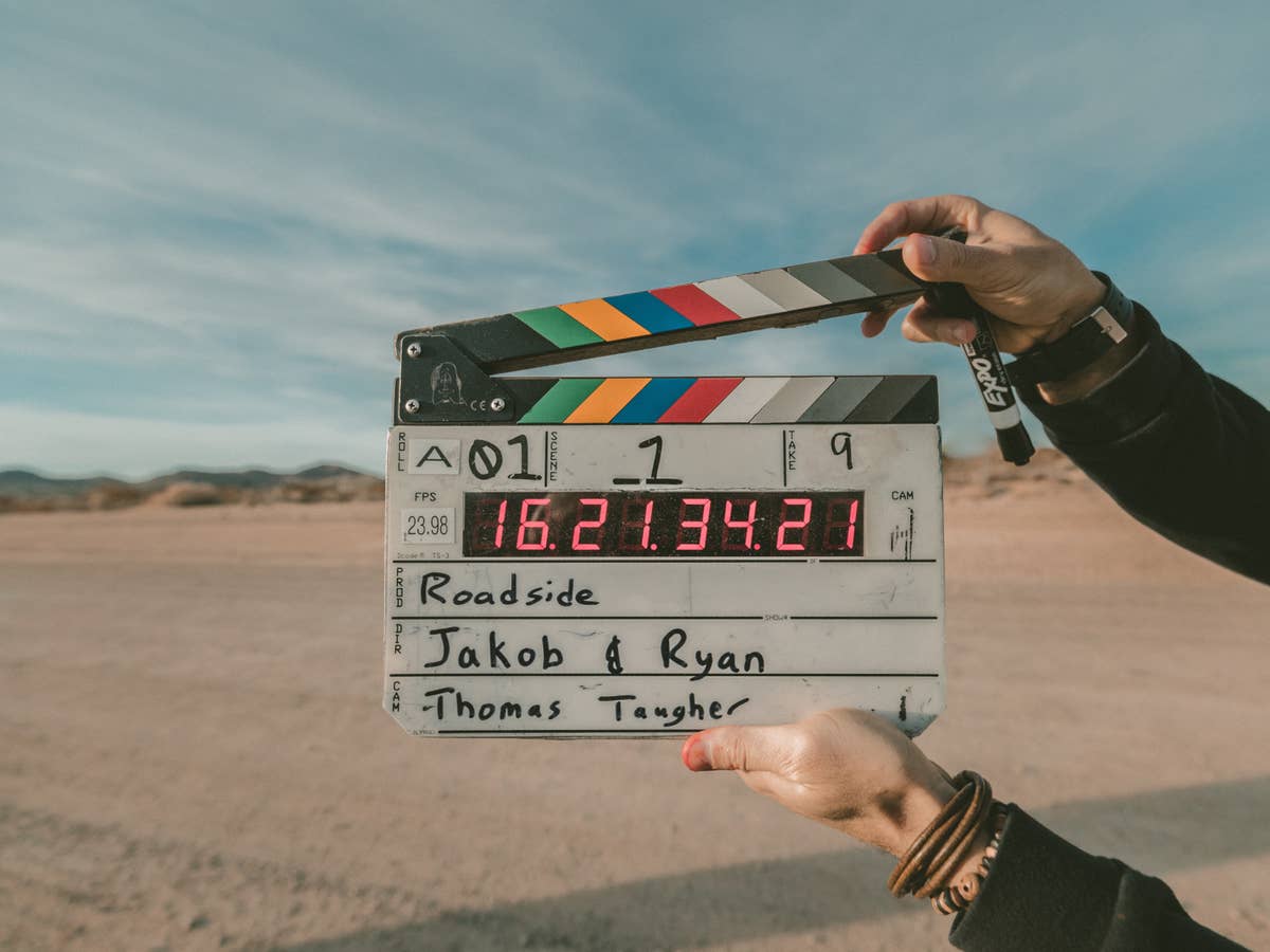 Clapperboard held by a person.