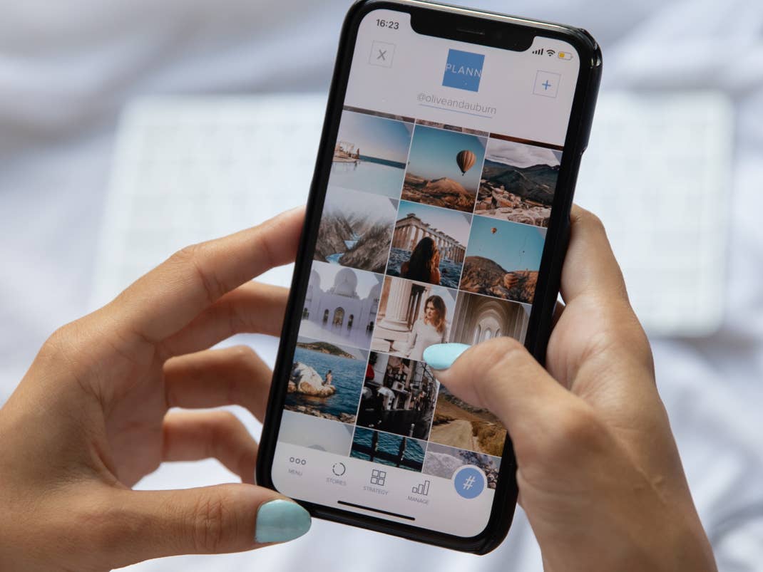 Smartphone in both hands and a thumb for control