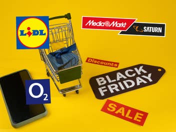 Ein Symbolbild für den Black Friday mit einem Einkaufswagen und einem Sale-Schild. Daneben Logos von MediaMarkt Lidl und O2, die bereits Black Week Angebote haben.