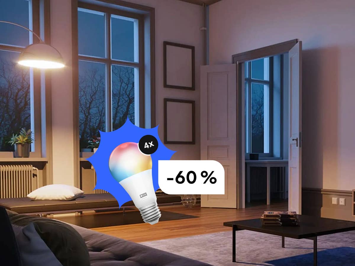 Smarte Glühbirnen viel günstiger - diese Deals lohnen sich jetzt Eine Lampe beleuchtet ein Wohnzimmer - im Vordergrund sieht man eine smarte Glühbirne mit Rabatt.