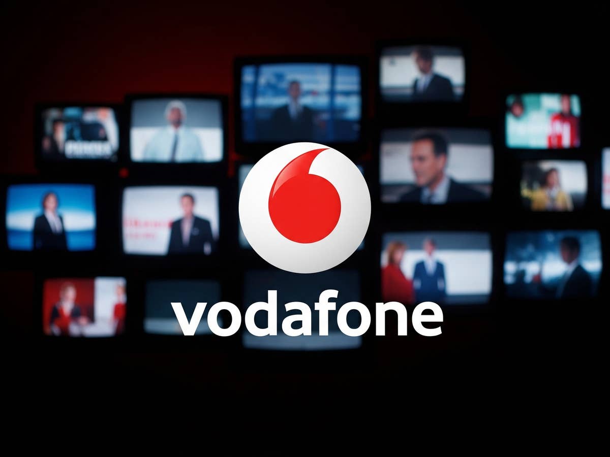 Vodafone-Logo vor Fernsehern im Hintergrund.