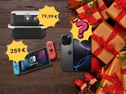 Verschiedene Produkt wie ein Ninja AirFryer, eine Nintendo Switch sowie ein iPhone mit Preisschildern, daneben Weihnachtsgeschenke